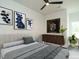 Well-appointed bedroom with soft gray tones, chic decor, and ample natural light at 1535 Urban Trace Ln, Raleigh, NC 27608