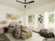 Bright bedroom with modern decor featuring natural light, a ceiling fan, and neutral colors at 1535 Urban Trace Ln, Raleigh, NC 27608