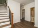 Inviting entryway featuring staircase and doorway to bath at 1535 Urban Trace Ln, Raleigh, NC 27608