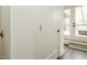 Bright hallway with neutral paint and access to the patio, featuring steps and hardwood floors at 1535 Urban Trace Ln, Raleigh, NC 27608