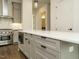 Modern kitchen features stainless steel appliances, marble backsplash, and a spacious white countertop island at 1535 Urban Trace Ln, Raleigh, NC 27608