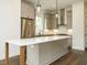 Gourmet kitchen with stainless steel appliances, a large center island and a window with a view at 1535 Urban Trace Ln, Raleigh, NC 27608