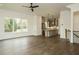 Modern kitchen with center island flows into the light and bright living room area at 1535 Urban Trace Ln, Raleigh, NC 27608