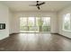 Open living area with dark wood flooring, a modern fireplace and sliding doors to balcony at 1535 Urban Trace Ln, Raleigh, NC 27608