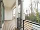 The patio is spacious and has a beautiful view of the wooded backyard, accessible by a sliding glass door at 1535 Urban Trace Ln, Raleigh, NC 27608