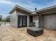 Modern rooftop deck showcases a kitchenette, access doors, and a contemporary fire pit for entertainment at 1535 Urban Trace Ln, Raleigh, NC 27608