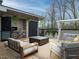 An inviting rooftop deck features a comfortable seating area, a barbecue area, and modern decor at 1535 Urban Trace Ln, Raleigh, NC 27608