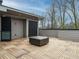 Spacious rooftop deck with a modern fire pit, grilling station, and access to a convenient kitchenette at 1535 Urban Trace Ln, Raleigh, NC 27608