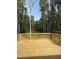 Lovely back deck with wooden railings overlooks a lush, green wooded area at 60 Lemon Drop Ln, Franklinton, NC 27525