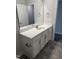 Modern bathroom vanity with white cabinets, sink, and mirror, offering stylish storage solutions at 60 Lemon Drop Ln, Franklinton, NC 27525