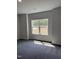 Bright bedroom with large window offering a serene view of the surrounding landscape and trees at 60 Lemon Drop Ln, Franklinton, NC 27525