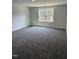 Spacious bedroom with a window that looks out over a lush green lawn, providing a peaceful ambiance at 60 Lemon Drop Ln, Franklinton, NC 27525