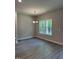 Cozy dining area with modern chandelier and views of the wooded landscape at 60 Lemon Drop Ln, Franklinton, NC 27525