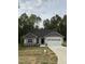 Charming single-story home with stone accents, a two-car garage, and a well-manicured lawn at 60 Lemon Drop Ln, Franklinton, NC 27525