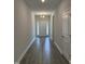 Inviting entryway showcasing modern gray wood-look flooring and neutral paint at 60 Lemon Drop Ln, Franklinton, NC 27525