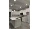 Spacious kitchen with island, quartz countertops, white cabinets, and stainless appliances at 60 Lemon Drop Ln, Franklinton, NC 27525