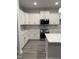 Bright kitchen with white cabinets, stainless appliances, and quartz countertops at 60 Lemon Drop Ln, Franklinton, NC 27525