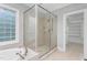 This spacious bathroom features a large shower and access to a walk-in closet at 6366 Lineberry Rd, Liberty, NC 27298