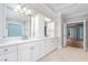 Bright bathroom featuring a double vanity, and an open door leads into a spacious main bedroom at 6366 Lineberry Rd, Liberty, NC 27298