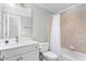 Clean bathroom with tub, tile, toilet, sink, vanity, and towel rack at 6366 Lineberry Rd, Liberty, NC 27298