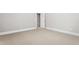 Bedroom with neutral paint, carpet, and trim, with view into hallway and doorway at 6366 Lineberry Rd, Liberty, NC 27298