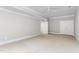 Neutral bedroom with carpet, trim, ceiling fan, and two doors at 6366 Lineberry Rd, Liberty, NC 27298