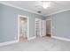 A bedroom has an attached bath and walk-in closet for convenience and comfort at 6366 Lineberry Rd, Liberty, NC 27298