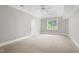 Neutral bedroom with carpet, trim, window and door at 6366 Lineberry Rd, Liberty, NC 27298