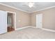 Neutral bedroom featuring soft carpet, bright lighting and white trim at 6366 Lineberry Rd, Liberty, NC 27298