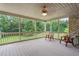 Screened porch with chairs and scenic view at 6366 Lineberry Rd, Liberty, NC 27298