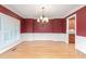 Formal dining room with hardwood floors and a chandelier at 6366 Lineberry Rd, Liberty, NC 27298