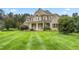 House exterior showcasing a spacious lawn and landscaping at 6366 Lineberry Rd, Liberty, NC 27298