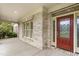 Front entrance with a red door and brick columns at 6366 Lineberry Rd, Liberty, NC 27298