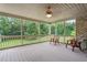 Relaxing screened porch with wood decking and wooded views at 6366 Lineberry Rd, Liberty, NC 27298