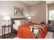 Comfortable bedroom with warm color palette and plenty of light at 1531 Urban Trace Ln, Raleigh, NC 27608