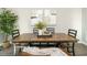 Modern dining area featuring a square wooden table and black chairs at 1531 Urban Trace Ln, Raleigh, NC 27608