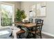 Dining room with a large wooden table and bench seating at 1531 Urban Trace Ln, Raleigh, NC 27608