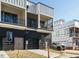 Townhome building showcasing rear elevation with attached garages at 1531 Urban Trace Ln, Raleigh, NC 27608