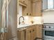 Modern kitchen with stainless steel appliances and light wood cabinets at 1531 Urban Trace Ln, Raleigh, NC 27608