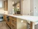 Kitchen boasting a large island with white countertops and light wood cabinets at 1531 Urban Trace Ln, Raleigh, NC 27608