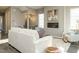 Living room showcasing a cozy fireplace and ample natural light at 1531 Urban Trace Ln, Raleigh, NC 27608
