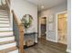 Modern staircase with wood treads and black metal railing at 1531 Urban Trace Ln, Raleigh, NC 27608
