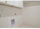 Laundry room with white walls and floors at 1533 Urban Trace Ln, Raleigh, NC 27608
