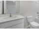 Clean bathroom featuring white cabinets and a large vanity sink at 791 Washington St, Fuquay Varina, NC 27526