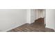 Neutral bedroom with wood-look flooring and a glass French door at 791 Washington St, Fuquay Varina, NC 27526