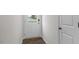 Bright entryway with wood-look floors, white walls, and a white entry door with glass insert at 791 Washington St, Fuquay Varina, NC 27526