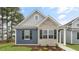 Charming single-story home featuring a mix of brick and siding, and a well-manicured lawn at 791 Washington St, Fuquay Varina, NC 27526