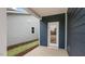 Covered patio with white trim, a view of the blue siding, and a door to the backyard at 791 Washington St, Fuquay Varina, NC 27526