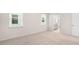 Comfortable bedroom with soft carpet, natural light, and an ensuite bathroom at 802 Dorset Stream Dr, Fuquay Varina, NC 27526