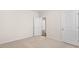 Cozy bedroom with neutral carpet, ample wall space, and modern doors at 802 Dorset Stream Dr, Fuquay Varina, NC 27526